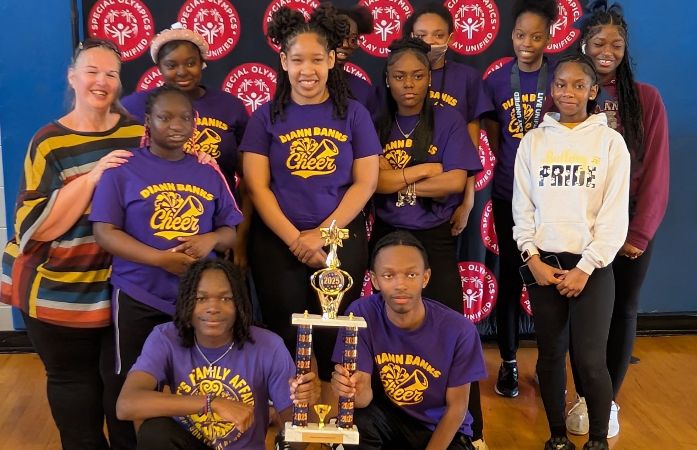  Cheer and Dance teams with their coach and trophies